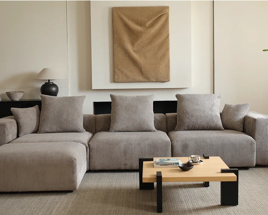Beige Marlow corduroy modular sofa in a warm modern living room